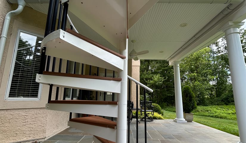 Exterior spiral staircase painted white