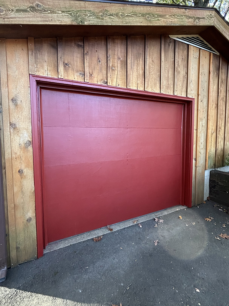 Exterior wood doors before staining — weathered and faded finish