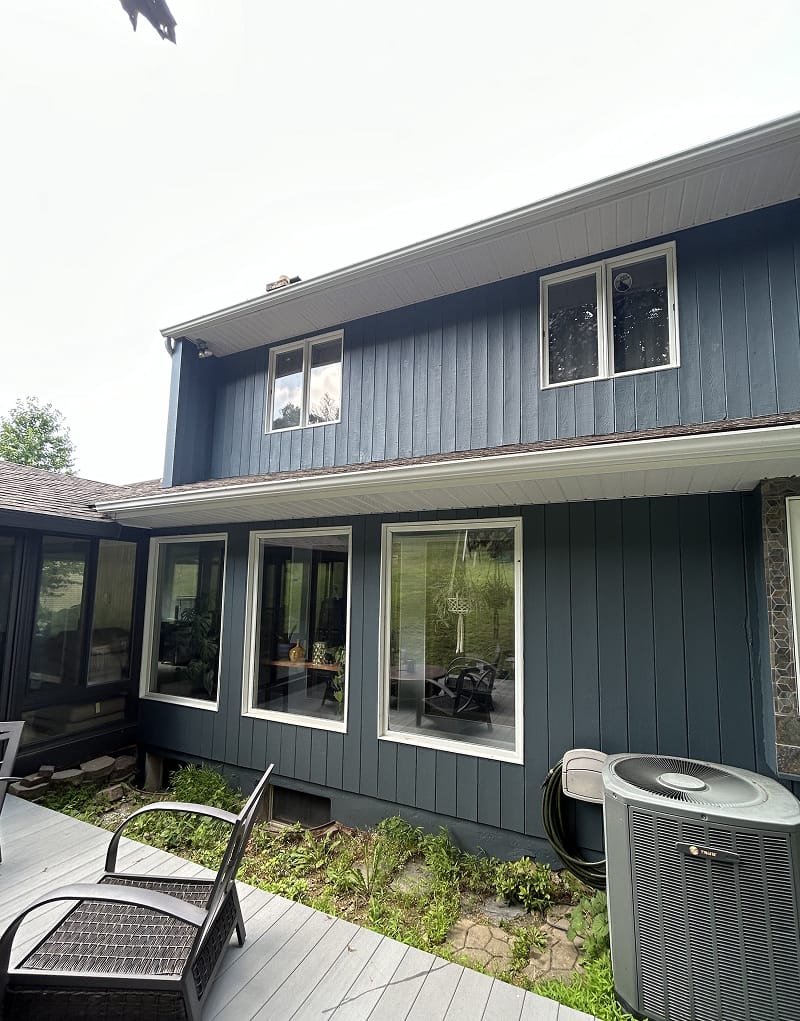 Exterior wood doors before staining — weathered and faded finish