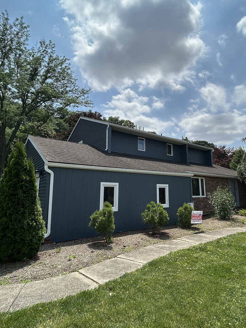 Exterior wood doors before staining — weathered and faded finish
