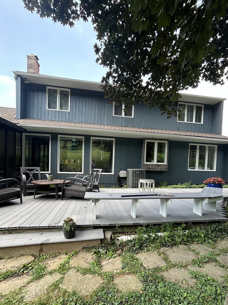 Exterior wood doors before staining — weathered and faded finish