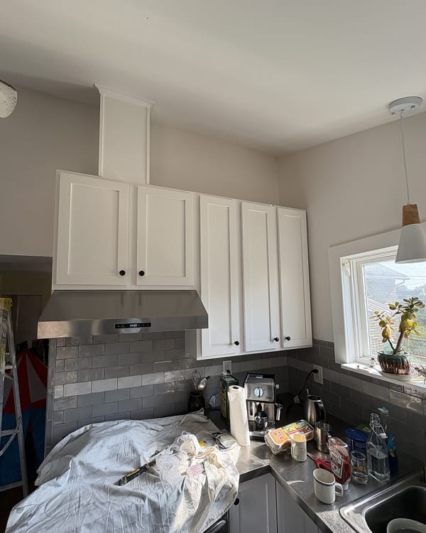 The same kitchen with the cabinets painted white