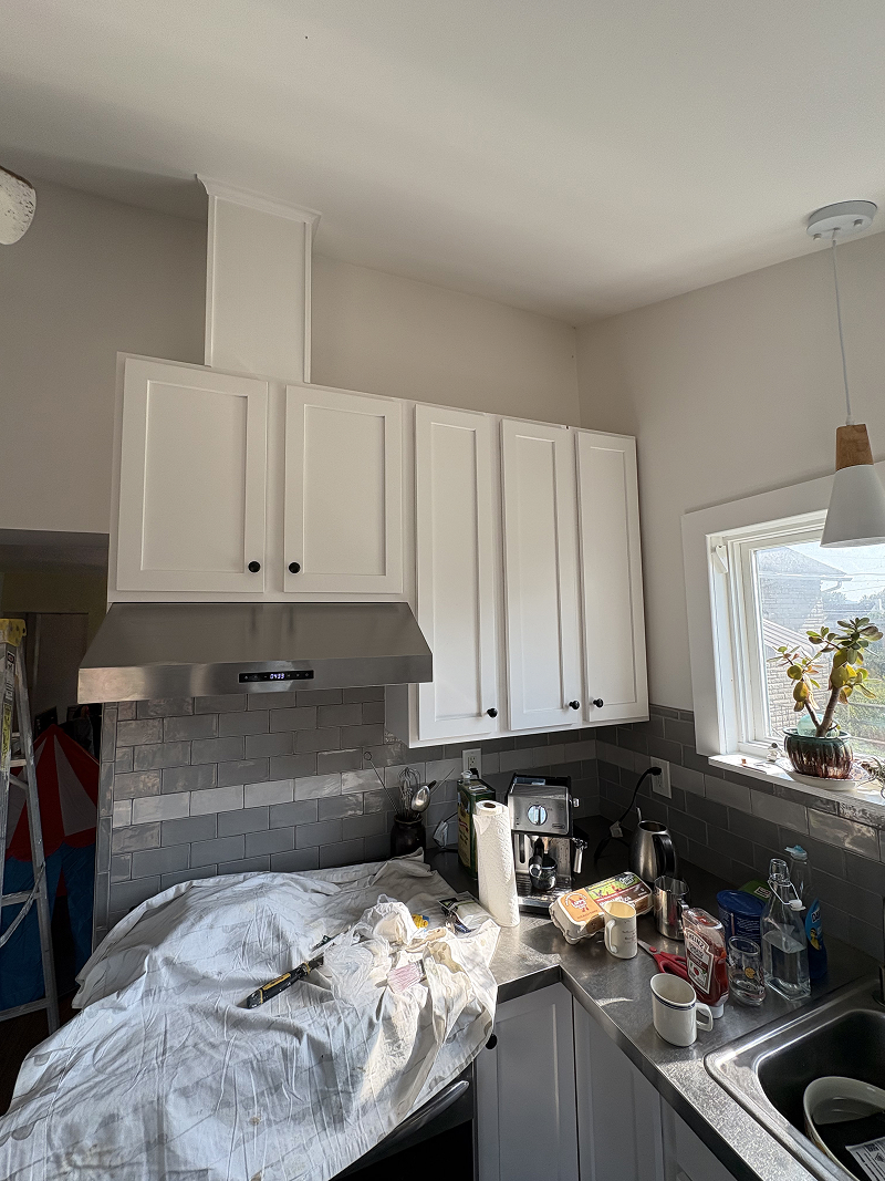 Interior cabinets before staining — weathered and faded finish